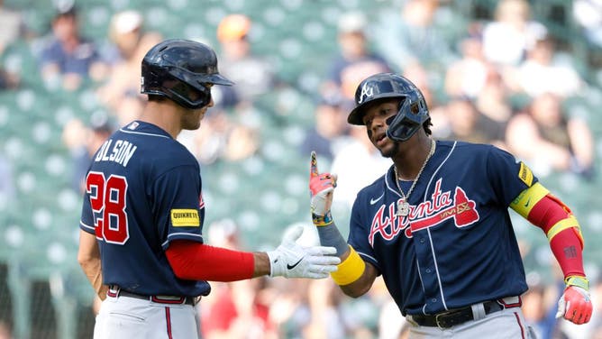 Atlanta' OF's Ronald Acuna Jr. celebrates with Matt Olson after hitting a solo HR vs. the Tigers.