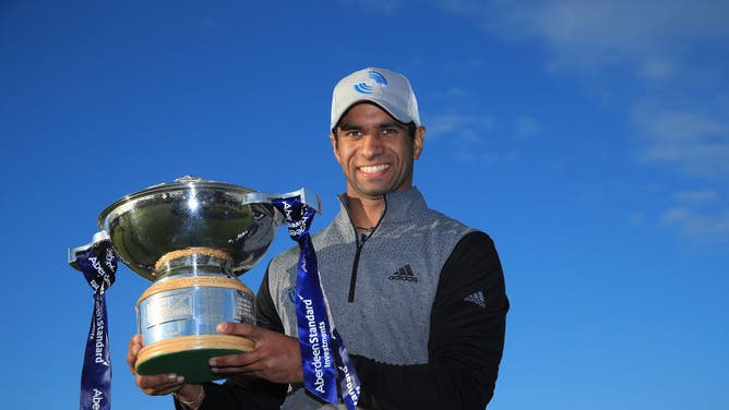 Aaron Rai poses with the trophy after beating Tommy Fleetwood in a one-hole play-off to win the 2020 Aberdeen Standard Investments Scottish Open at The Renaissance Club.
