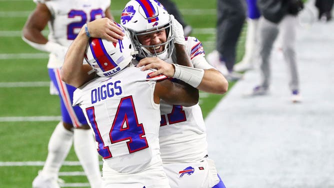 Buffalo Bills QB Josh Allen celebrates with WR Stefon Diggs after a TD during the 1st half against the New England Patriots at Gillette Stadium in Foxborough, Massachusetts.