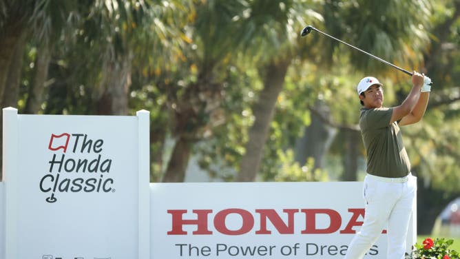 Byeong-Hun An plays his shot from the 4th tee during the 1st round of The Honda Classic at PGA National Champion course in Palm Beach Gardens, Florida.