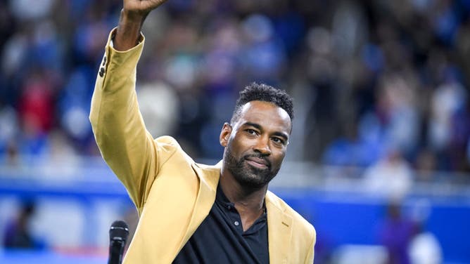 Calvin Johnson of the Detroit Lions is honored with a Hall of Fame ring during a ceremony at halftime at Ford Field.