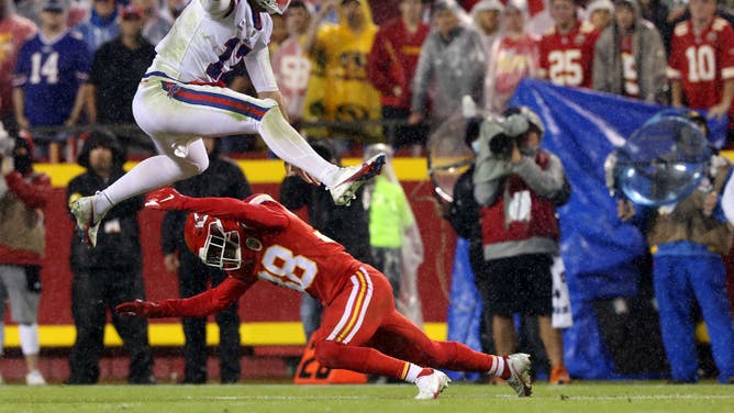 Josh Allen leaps over a Chiefs defender in an NFL Week 5 win last season against Kansas City.