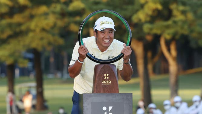 Hideki Matsuyama poses with the trophy after winning the 2021 ZOZO Championship at Accordia Golf Narashino Country Club in Inzai, Chiba, Japan.