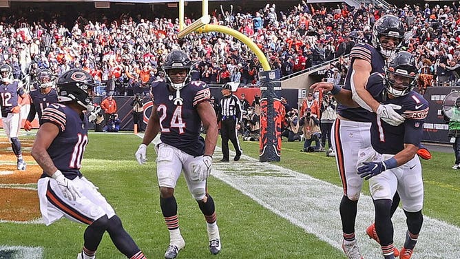 The Chicago Bears celebrate a Justin Fields TD run against the San Francisco 49ers at Soldier Field in Chicago.