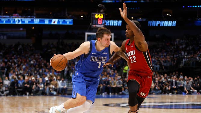 Mavericks Luka Doncic drives the ball vs. Heat SF Jimmy Butler at American Airlines Center in Dallas.
