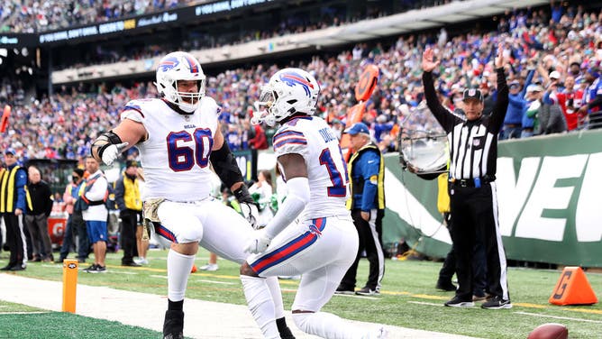 Buffalo Bills WR Stefon Diggs celebrates a TD with offensive linemen Mitch Morse against the New York Jets at MetLife Stadium in East Rutherford, New Jersey.