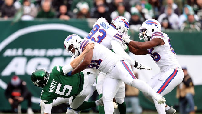 New York Jets QB Mike White is leveled by Buffalo Bills DT Ed Oliver at MetLife Stadium in East Rutherford, New Jersey.