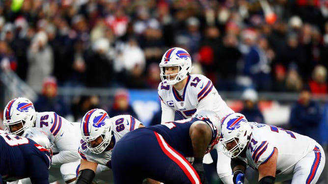 Buffalo Bills QB Josh Allen looks over the line of scrimmage during the 4th quarter against the New England Patriots at Gillette Stadium in Foxborough, Massachusetts.