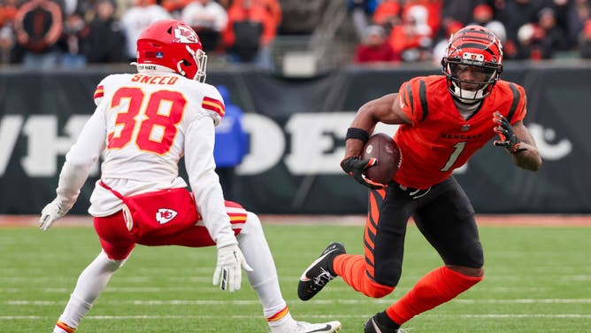 Ja'Marr Chase of the Cincinnati Bengals runs with the ball while being chased by L'Jarius Sneed of the Kansas City Chiefs in the fourth quarter at Paul Brown Stadium on January 02, 2022 in Cincinnati, Ohio.