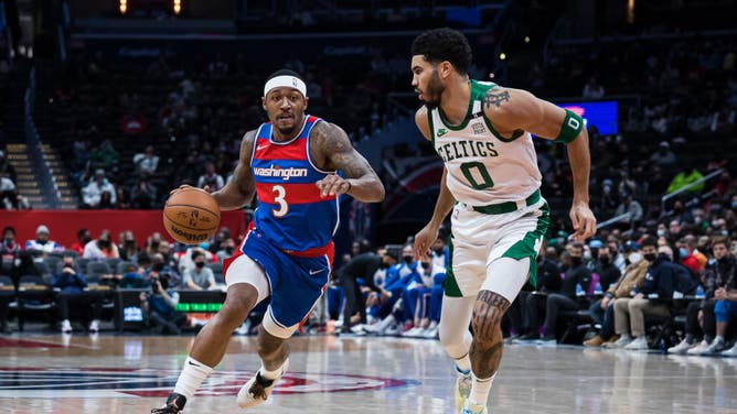 Washington Wizards' Bradley Beal drives to the basket against Boston Celtics wing Jayson Tatum at Capital One Arena in Washington, DC.