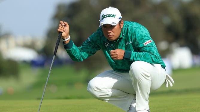 Hideki Matsuyama lines up his putt on the 10th hole during the third round of The Farmers Insurance Open at Torrey Pines Golf Course in La Jolla, California.