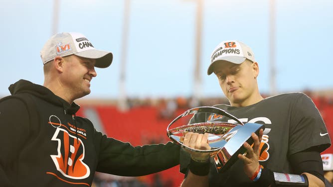 Bengals QB Joe Burrow and coach Zac Taylor pose with the Lamar Hunt Trophy after Cincy defeated the Kansas City Chiefs in the AFC Championship Game at Arrowhead Stadium in Kansas City, Missouri.