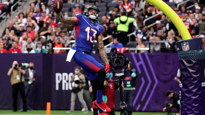 Mike Evans of the Tampa Bay Buccaneers and NFC celebrates after scoring a 19-yard touchdown against the AFC with a between-the-legs dunk through the goal post in the first half of the 2022 NFL Pro Bowl at Allegiant Stadium.