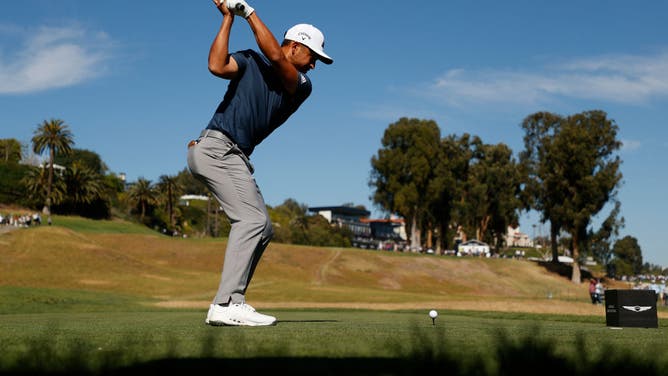 Xander Schauffele plays his shot from the 18th tee during the third round of The Genesis Invitational at Riviera Country Club in Pacific Palisades, California.