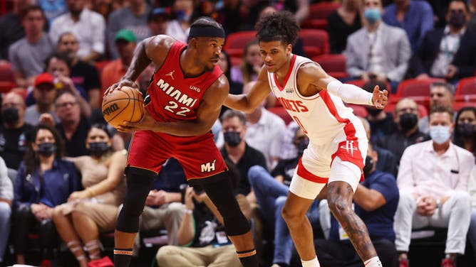 Miami Heat All-Star Jimmy Butler is defended by Houston Rockets SG Jalen Green at FTX Arena in Miami.