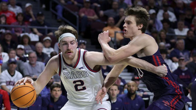 Gonzaga C Drew Timme is fouled by Saint Mary's C Mitchell Saxen during the West Coast Conference championship at the Orleans Arena in Las Vegas.