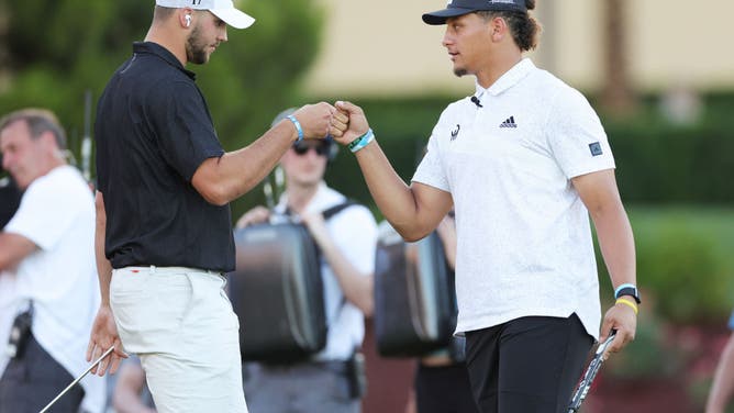 Josh Allen and Patrick Mahomes bump fists during Capital One's The Match VI - Brady & Rodgers v Allen & Mahomes at Wynn Golf Club on June 01, 2022 in Las Vegas, Nevada.