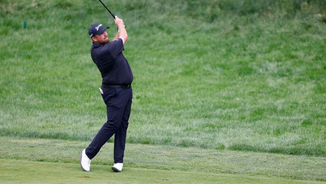 Shane Lowry plays an approach shot on the 1st hole during Round 4 of the 2022 RBC Canadian Open at St. George's Golf and Country Club in Etobicoke, Ontario.