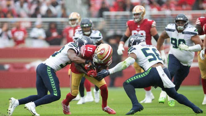 San Francisco 49ers WR Brandon Aiyuk runs after making a catch during the game against the Seattle Seahawks at Levi's Stadium in Santa Clara, California.