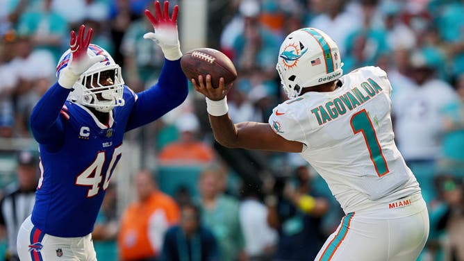 Dolphins QB Tua Tagovailoa throws the ball over Bills pass rusher Von Miller at Hard Rock Stadium in Miami.
