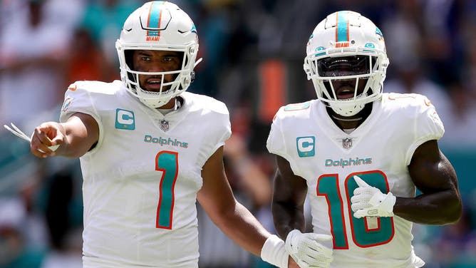 Miami Dolphins QB Tua Tagovailoa and WR Tyreek Hill in action during the 1st half of the game against the Buffalo Bills at Hard Rock Stadium in Miami.