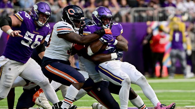 Minnesota Vikings RB Alexander Mattison is gang-tackled by the Chicago Bears at U.S. Bank Stadium in Minneapolis.