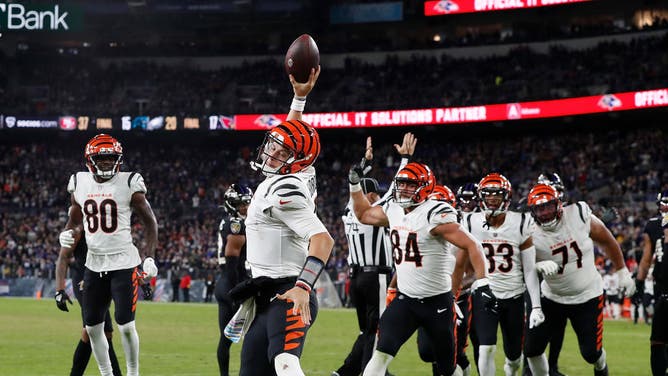 Cincinnati Bengals Joe Burrow spikes the football after rushing for a touchdown against the Baltimore Ravens at M&T Bank Stadium in Baltimore, Maryland.