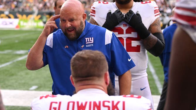 New York Giants head coach Brian Daboll coaches up his guys sidelines during a game against the Green Bay Packers at Tottenham Hotspur Stadium in London.