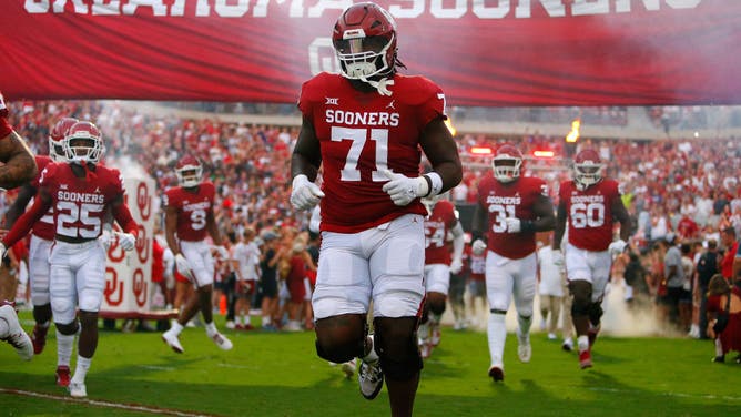 Oklahoma Sooners LT Anton Harrison runs onto the field for a game vs. the Kansas State Wildcats at Gaylord Family Oklahoma Memorial Stadium in Norman.