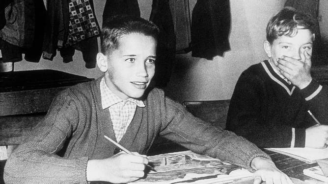 Eleven-year-old Arnold poses for a photo in art class in 1958 in Thal, Austria.