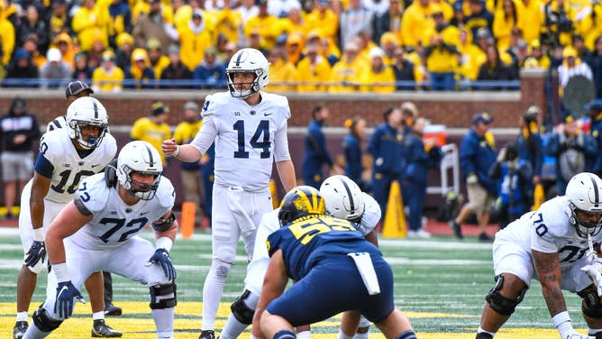 Penn State Nittany Lions QB Sean Clifford signals the play against the Michigan Wolverines at Michigan Stadium in Ann Arbor, Michigan.