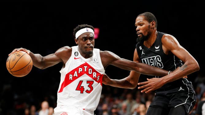 Toronto Raptors SF Pascal Siakam dribbles vs. Brooklyn Nets' Kevin Durant at Barclays Center in Brooklyn.