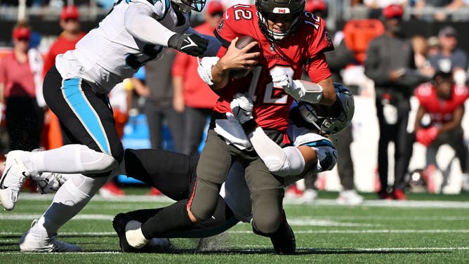 Tampa Bay Buccaneers Tom Brady gets sack-lunched by the Carolina Panthers defense at Bank of America Stadium in Charlotte, North Carolina.