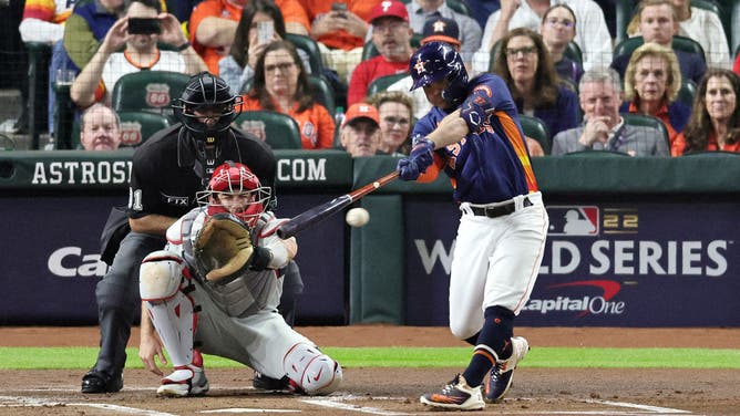 Houston Astros 2B Jose Altuve knocks a 1st-inning double in Game 2 of the 2022 World Series at Minute Maid Park in Houston.