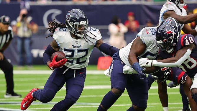 Tennessee Titans RB Derrick Henry runs the ball as he gets a block against the Houston Texans at NRG Stadium in Houston.