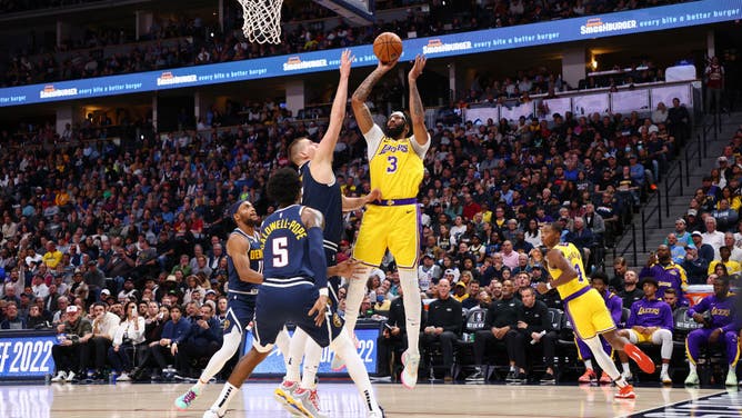 Nuggets C Nikola Jokic defends a Lakers' Anthony Davis turnaround jumper at Ball Arena in Denver, Colorado.
