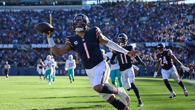Chicago Bears QB Justin Fields scores a TD during the second half in the game against the Miami Dolphins at Soldier Field in Chicago.