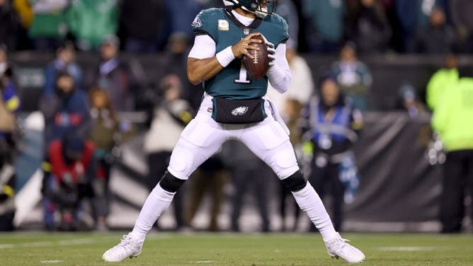 Philadelphia Eagles QB Jalen Hurts drops back to pass against the Washington Commanders during the fourth quarter in the game at Lincoln Financial Field in Philadelphia.