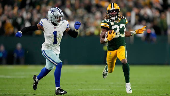 Green Bay Packers RB Aaron Jones runs with the ball against the Dallas Cowboys in the second half at Lambeau Field in Green Bay, Wisconsin.