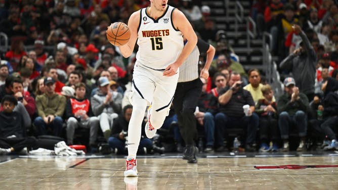 Denver Nuggets big Nikola Jokic controls the ball against the Chicago Bulls at the United Center in Chicago.