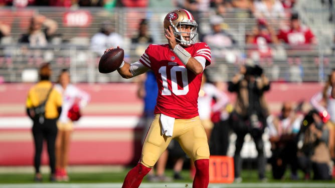 San Francisco 49ers QB Jimmy Garoppolo drops back to pass against the New Orleans Saints during the 1st quarter of an NFL football game at Levi's Stadium in Santa Clara, California.