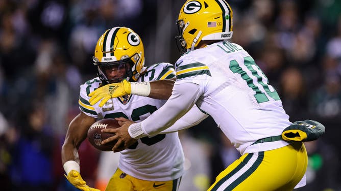 Jordan Love of the Green Bay Packers hands the ball off to Aaron Jones during a 2022 game against the Philadelphia Eagles.