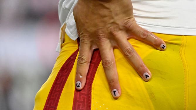 A detailed view of the fingernails of Caleb Williams of the USC Trojans that spell out Utah.