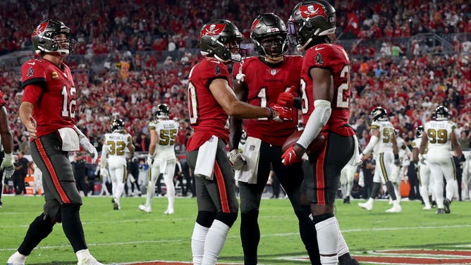 Tampa Bay Buccaneers RB Rachaad White celebrates with teammates after scoring a go-ahead TD vs. the New Orleans Saints in the 4th quarter at Raymond James Stadium in Tampa, Florida.