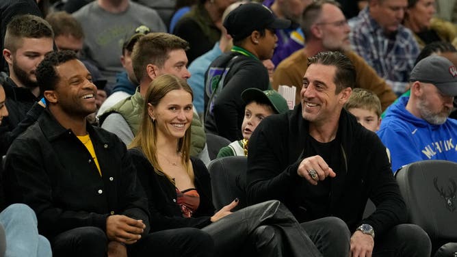 Aaron Rodgers and Mallory Edens go PDA heavy at birthday party.
