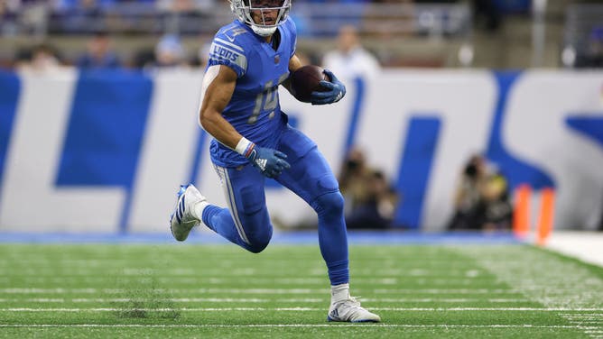Lions WR Amon-Ra St. Brown runs with the ball against the Vikings at Ford Field in Detroit.