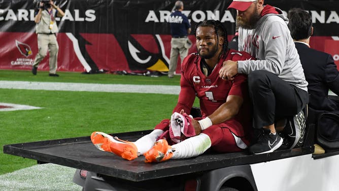 Kyler Murray of the Arizona Cardinals is carted off the field after being injured against the New England Patriots during Monday Night Football.