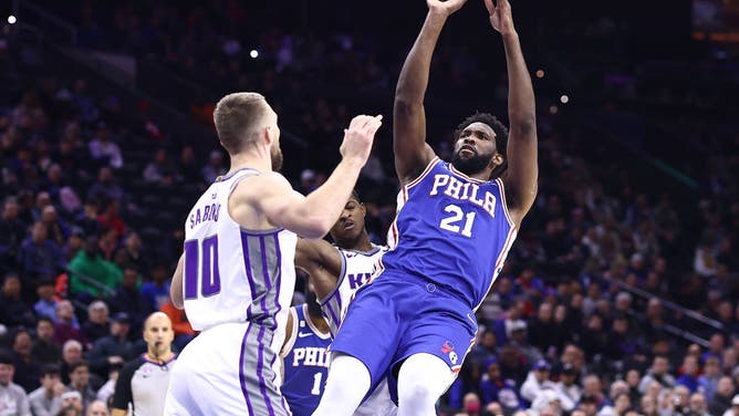 Philadelphia 76ers big Joel Embiid shoots over Sacramento Kings big Domantas Sabonis at Wells Fargo Center in Philadelphia.