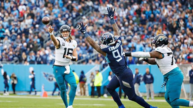 Jaguars QB Trevor Lawrence throws a pass under pressure from Titans DE Mario Edwards at Nissan Stadium in Nashville.