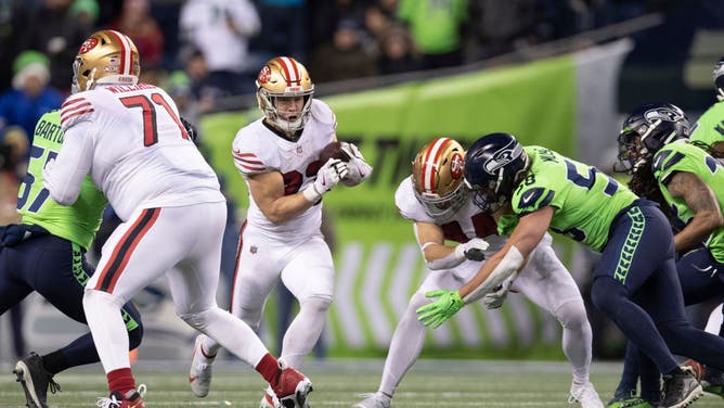 San Francisco 49ers RB Christian McCaffrey rushes during the game against the Seattle Seahawks at Lumen Field in Seattle, Washington.
